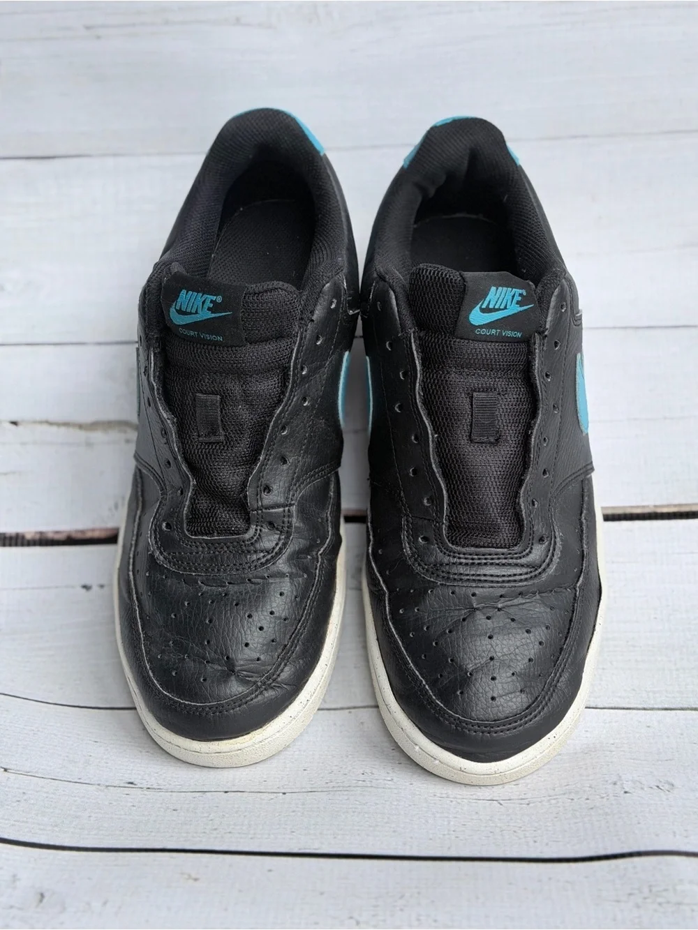 Nike Men’s Black Sneakers with Blue Swoosh